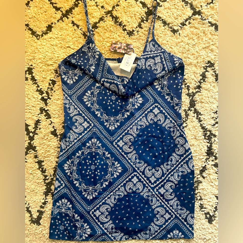 Cider mini dress with zipper in the back. Material does not stretch.